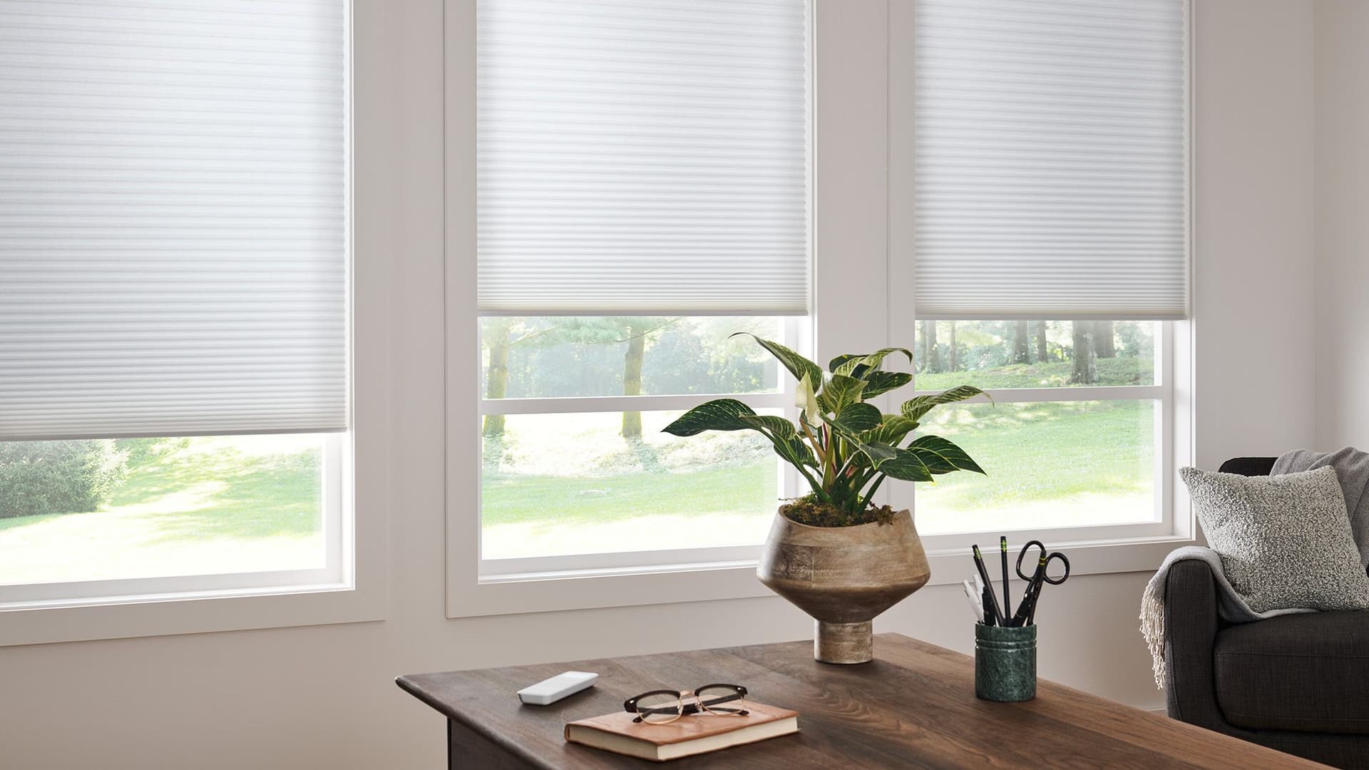 App-controlled shades for effortless morning light in a bedroom bay window